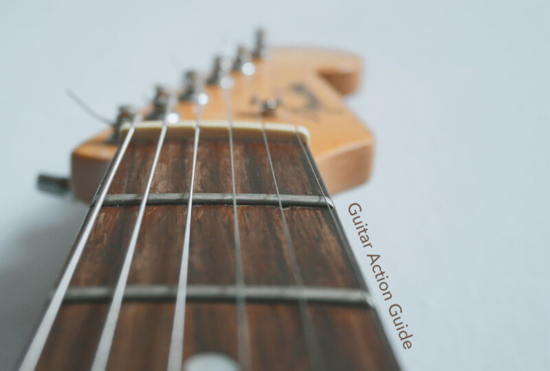 ギター指板をヘッド側から捉えたクローズアップ写真（Guitar Action Guideの文字入り）