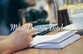 ノートに音楽練習の記録を書き込む手元のクローズアップ